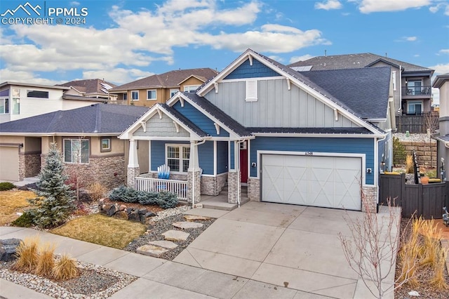 craftsman inspired home with a porch and a garage