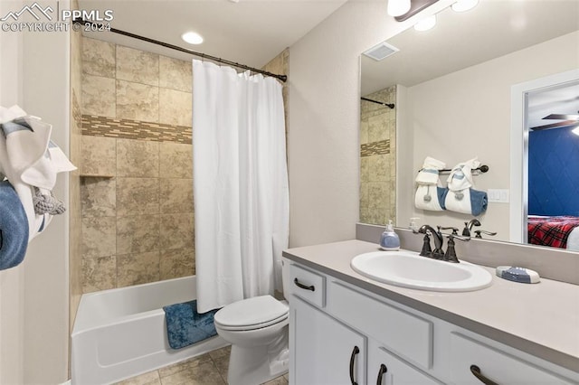 full bathroom featuring tile patterned floors, vanity, ceiling fan, shower / bathtub combination with curtain, and toilet