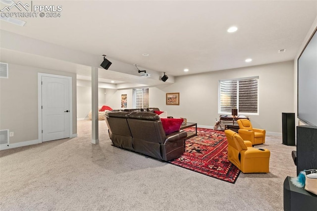 living room featuring plenty of natural light and light colored carpet