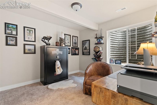 office with light carpet and beamed ceiling