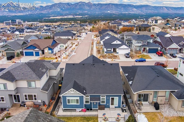 birds eye view of property with a mountain view