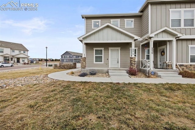 view of front of home featuring a front lawn and a porch