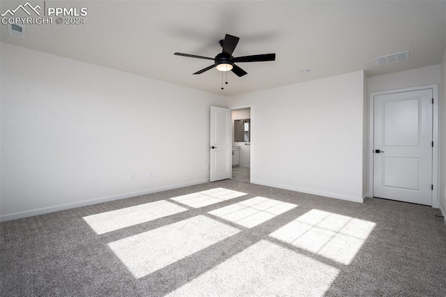 unfurnished bedroom featuring ceiling fan and light carpet