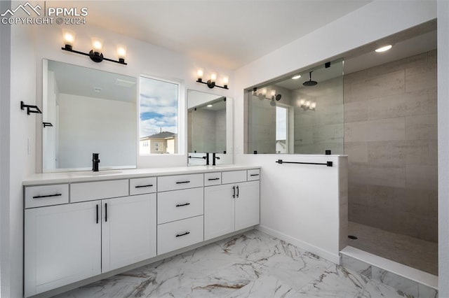 bathroom featuring vanity and tiled shower