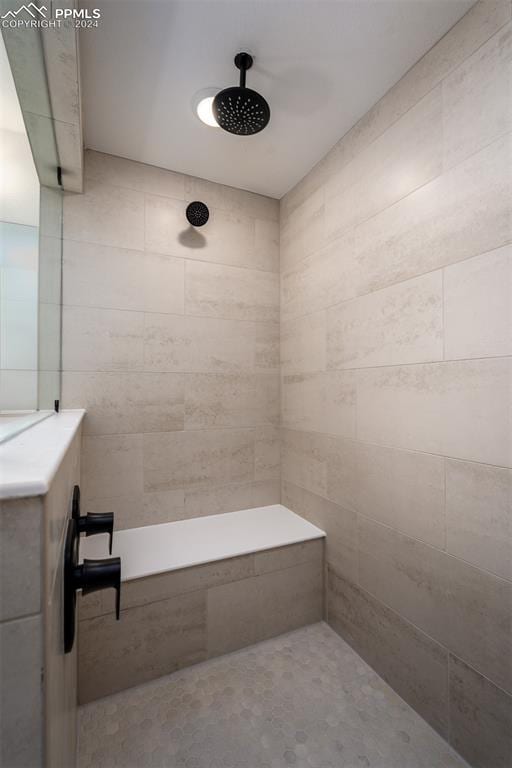 bathroom with a tile shower