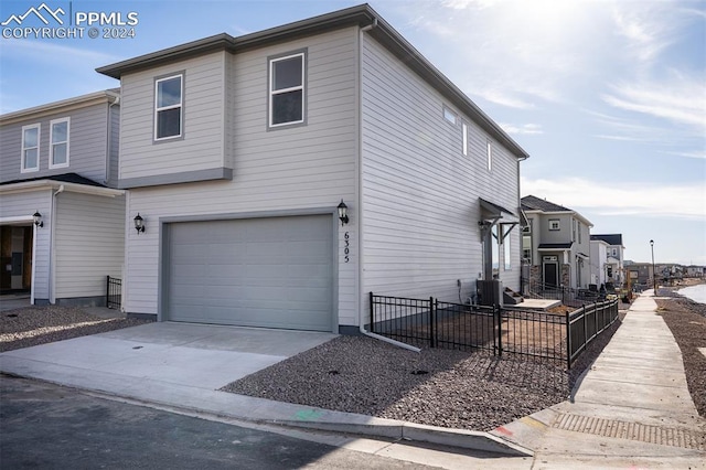 view of side of property featuring a garage