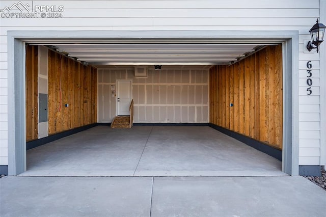 garage with wood walls