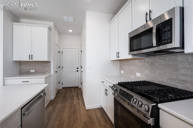 kitchen with tasteful backsplash, dark wood-type flooring, white cabinets, and stainless steel appliances