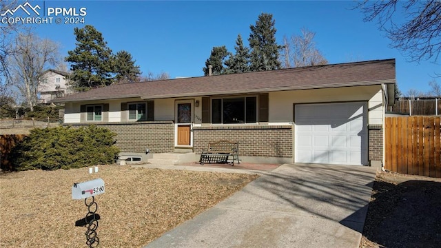 ranch-style home featuring a garage