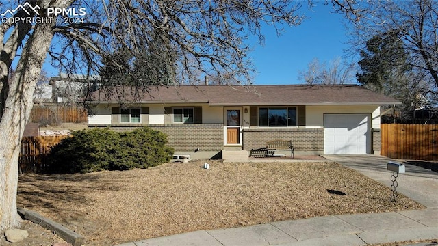 ranch-style house featuring a garage