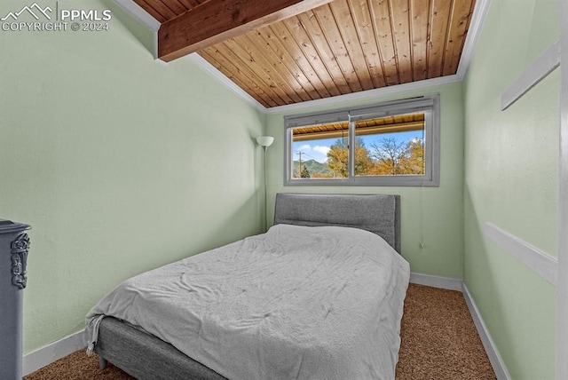 bedroom featuring beam ceiling, wood ceiling, and ornamental molding