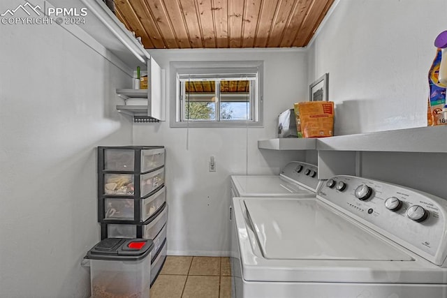 laundry area featuring independent washer and dryer, light tile patterned flooring, and wood ceiling