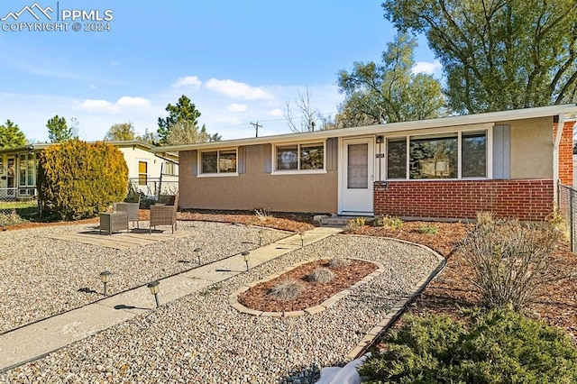 ranch-style house with a patio area