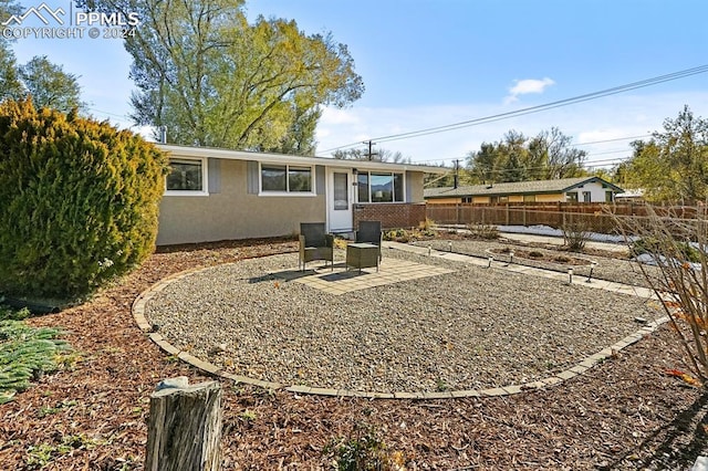 rear view of property with a patio area