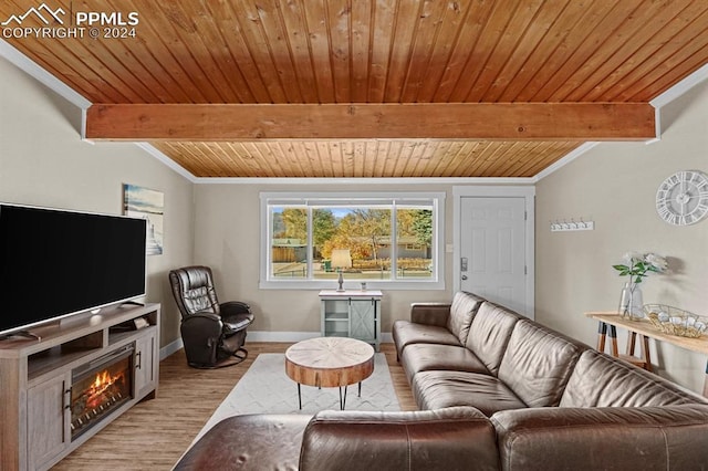 living room with vaulted ceiling with beams, light hardwood / wood-style flooring, and wood ceiling