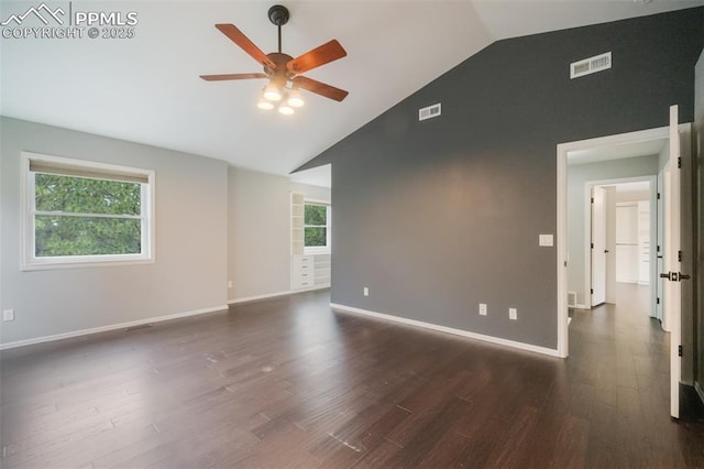 spare room featuring dark hardwood / wood-style floors, ceiling fan, and lofted ceiling