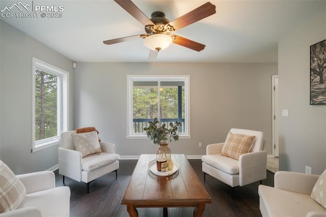 sitting room with dark hardwood / wood-style floors, ceiling fan, and plenty of natural light