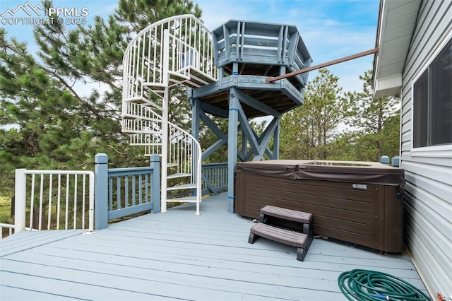 wooden terrace with a hot tub