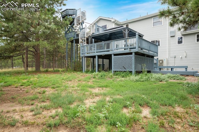 back of house featuring a deck