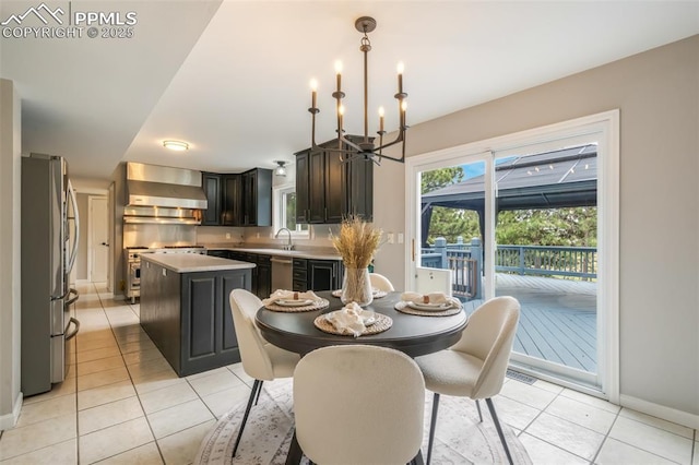 tiled dining room with a notable chandelier and sink