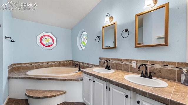 bathroom featuring vanity and a bathing tub