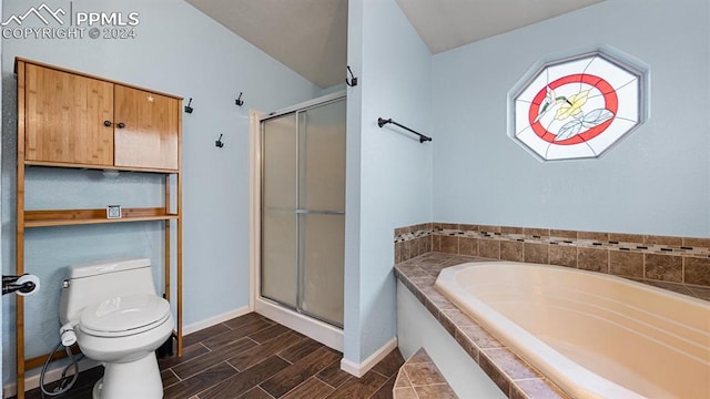 bathroom featuring toilet, shower with separate bathtub, and vaulted ceiling