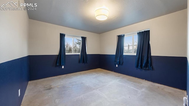 spare room featuring a textured ceiling