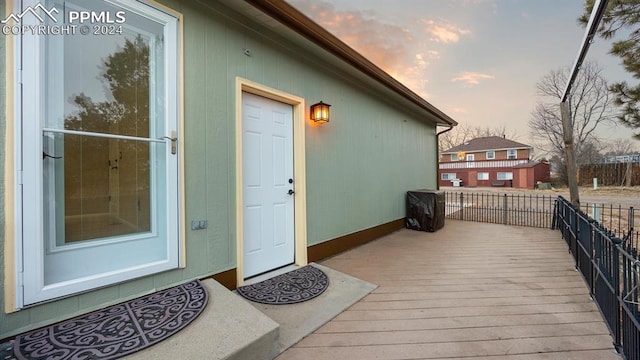 view of exterior entry at dusk