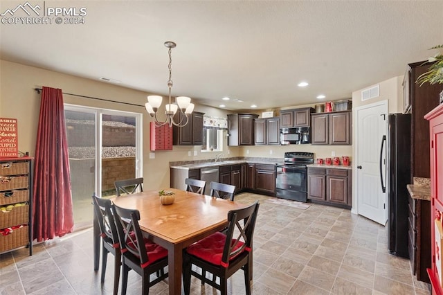 dining space with an inviting chandelier and sink