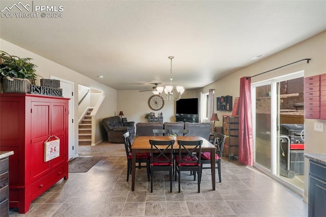 dining area with an inviting chandelier