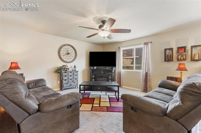 carpeted living room featuring ceiling fan