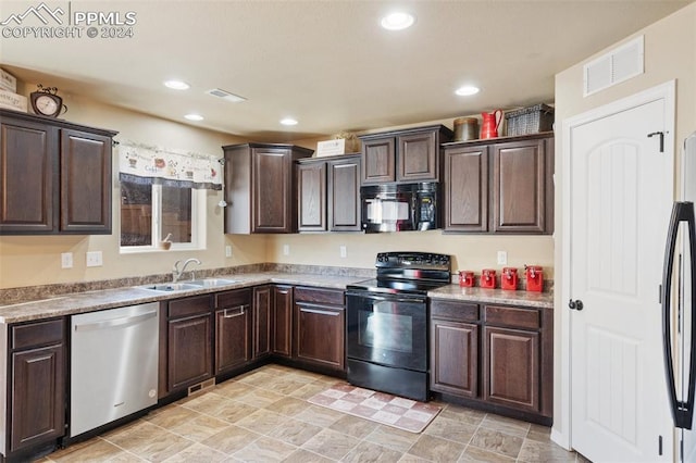 kitchen with black appliances, dark brown cabinets, and sink