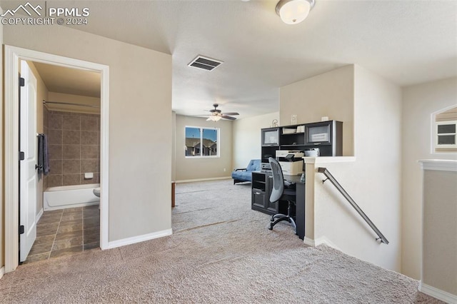 carpeted home office with ceiling fan