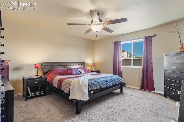 bedroom featuring light carpet and ceiling fan