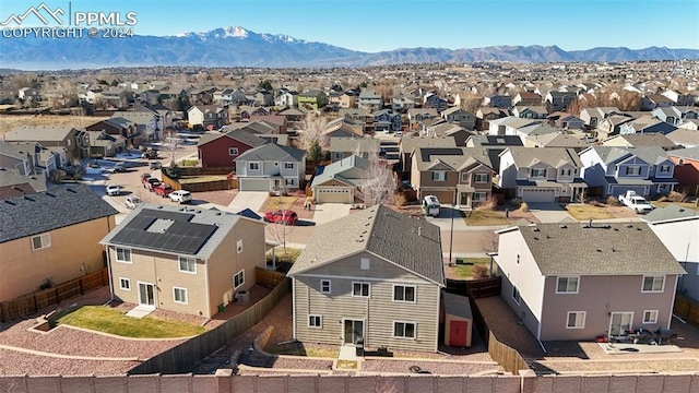 birds eye view of property with a mountain view