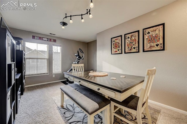 view of carpeted dining area