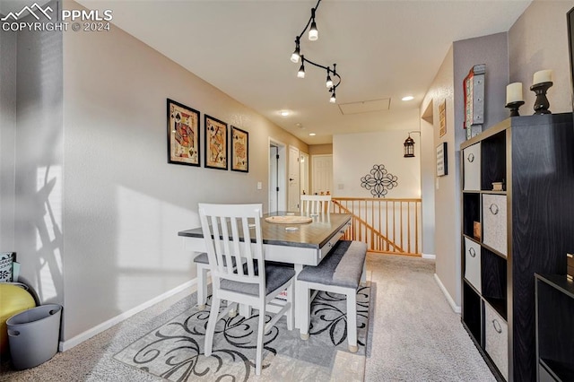 view of carpeted dining area