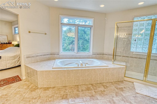 bathroom with tile patterned flooring and a shower with door