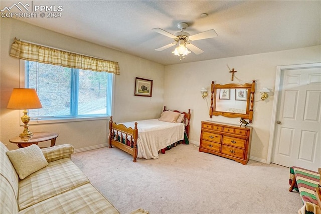 bedroom with light colored carpet and ceiling fan