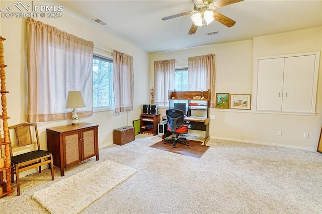 carpeted office with ceiling fan