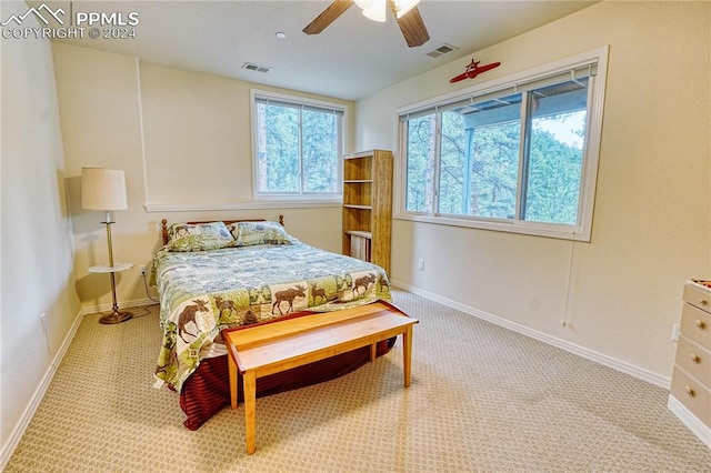 carpeted bedroom with ceiling fan