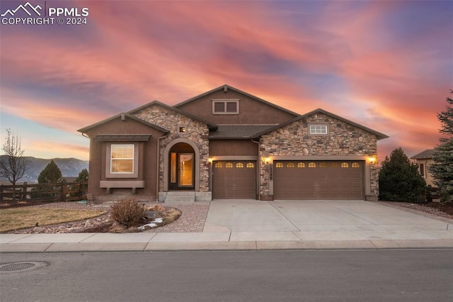 view of front of home featuring a mountain view and a garage