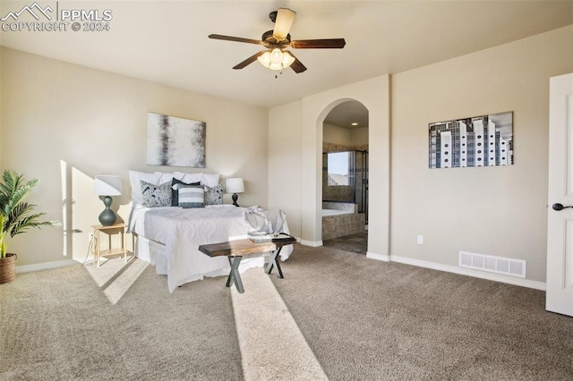 bedroom featuring carpet flooring, ensuite bath, and ceiling fan