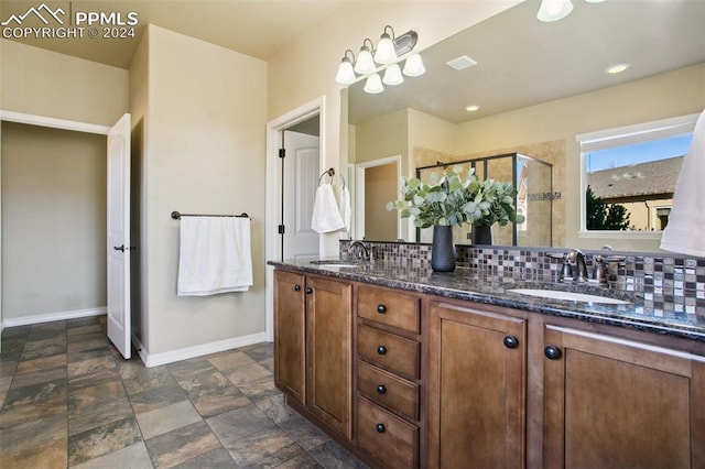 bathroom with decorative backsplash, vanity, and an enclosed shower