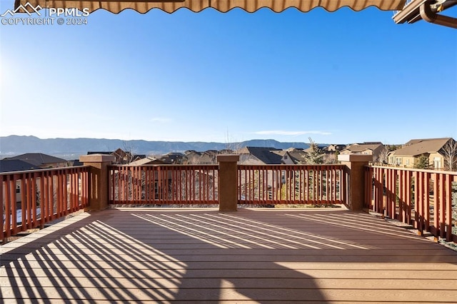 wooden deck with a mountain view