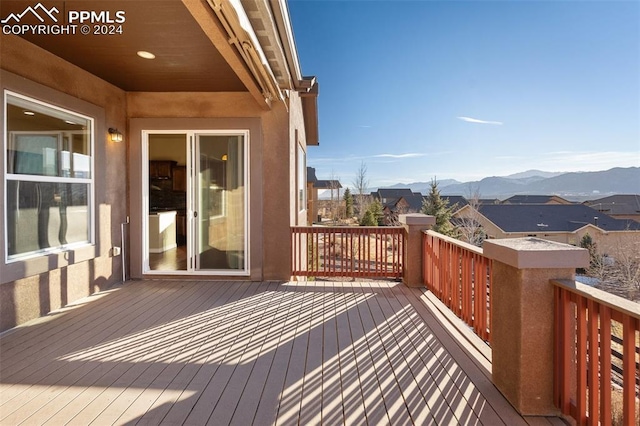 wooden terrace with a mountain view