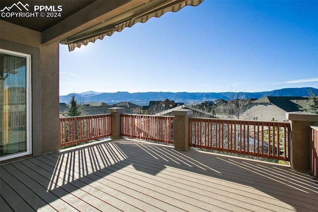 wooden terrace with a mountain view