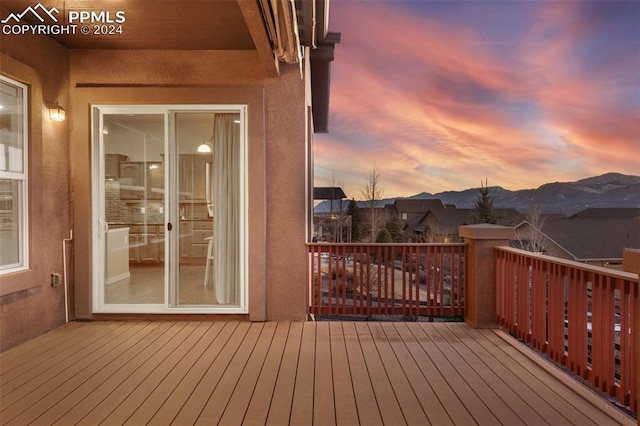 deck at dusk with a mountain view