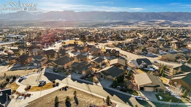 birds eye view of property with a mountain view