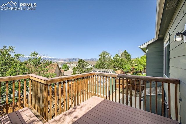 wooden deck with a mountain view